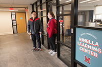 Students outside entryway to Rinella Learning Center
