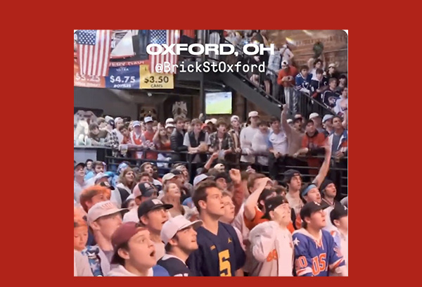 Crowd of students cheers at Brick Street during the US v Iran World Cup soccer game