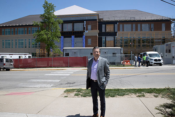 Rick McVey '81 stands in front of McVey Data Science under construction