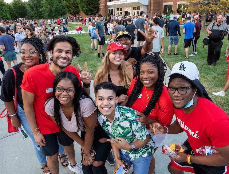 A group of first-year students pose for a photo during a festival