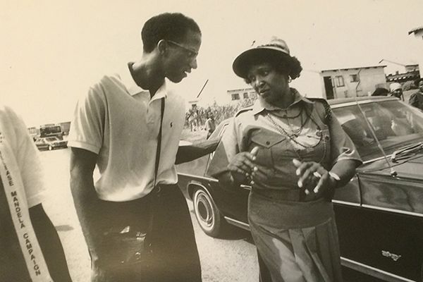 Wil Haygood walks alongside Winnie Mandela in South Africa in the days of hot demonstration before Nelson Mandela was released from prison.