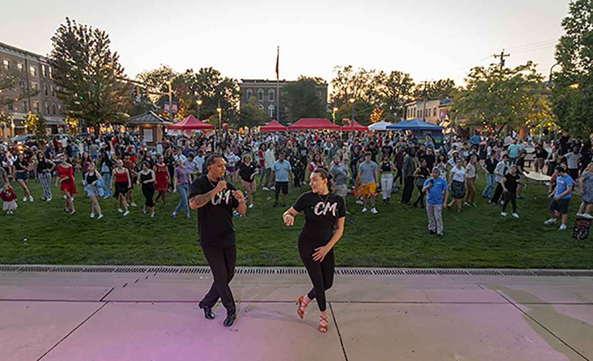 The audience learns dance steps led by 2 dancers at the unidiversity festival