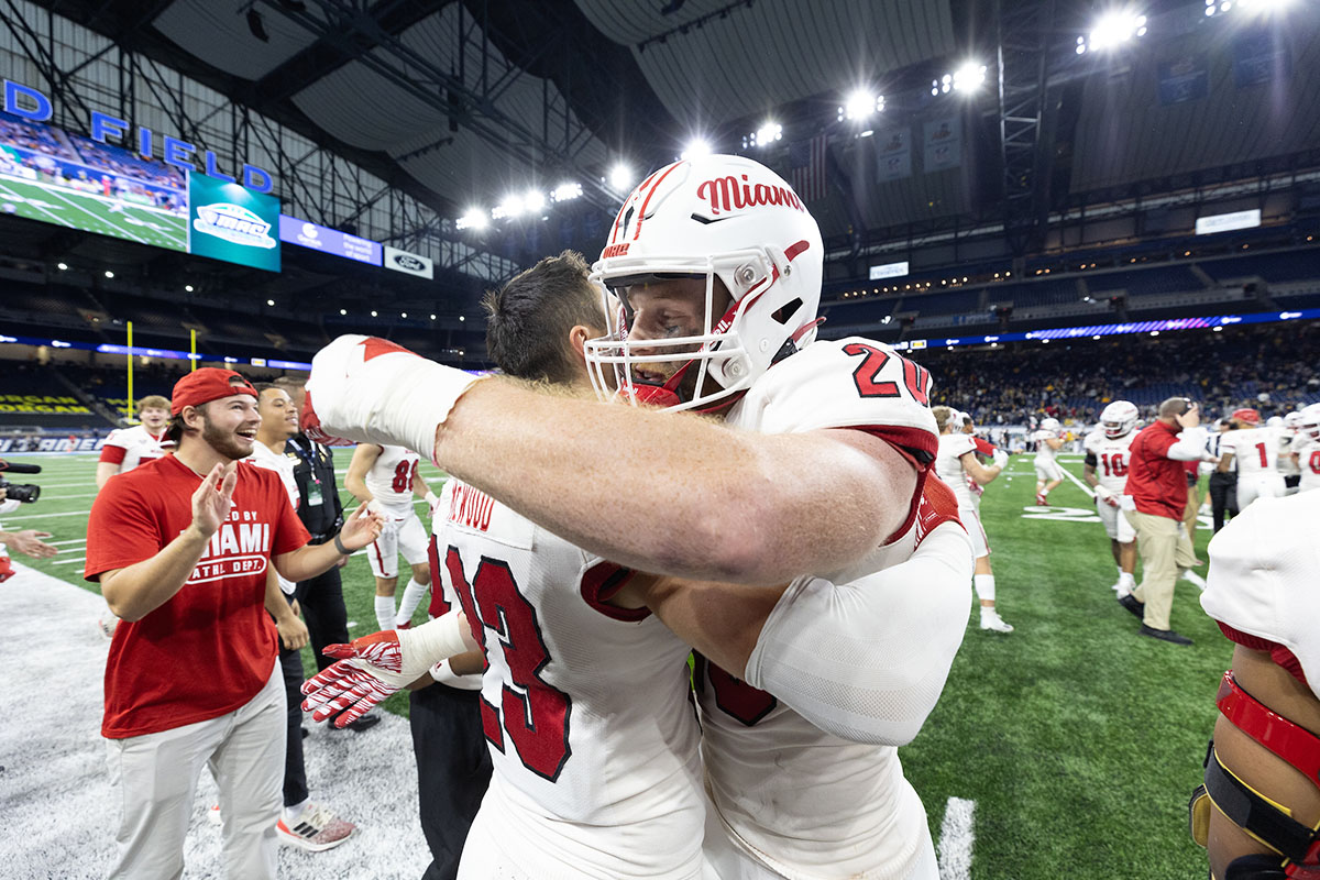 Miami's football players celebrate