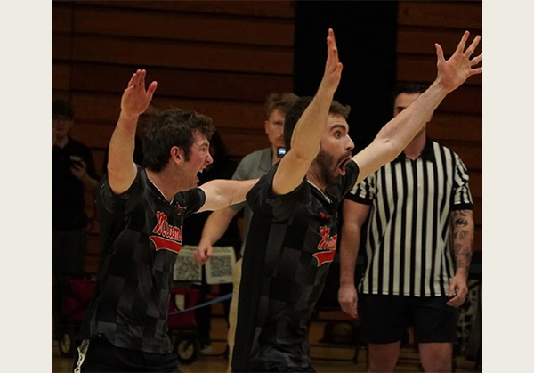 Miami University Club Dodgeball players Ty Keller, left, and Max Edling react to their team's 2-1 overtime win over the University of Cincinnati (photo by Kris Haas).
