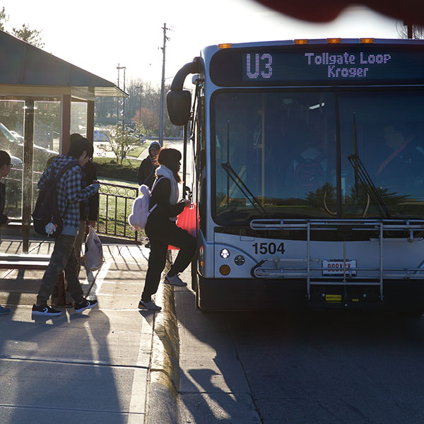 Students boarding a campus shuttle bus